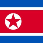 North Korean landscape with mountains and traditional buildings, symbolizing restricted travel