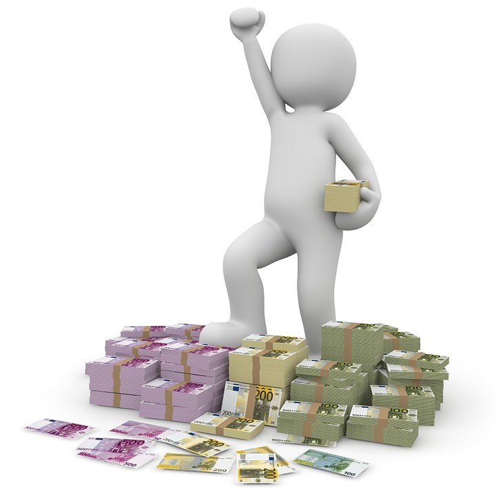 Figurine on stacks of money symbolizing agency fees