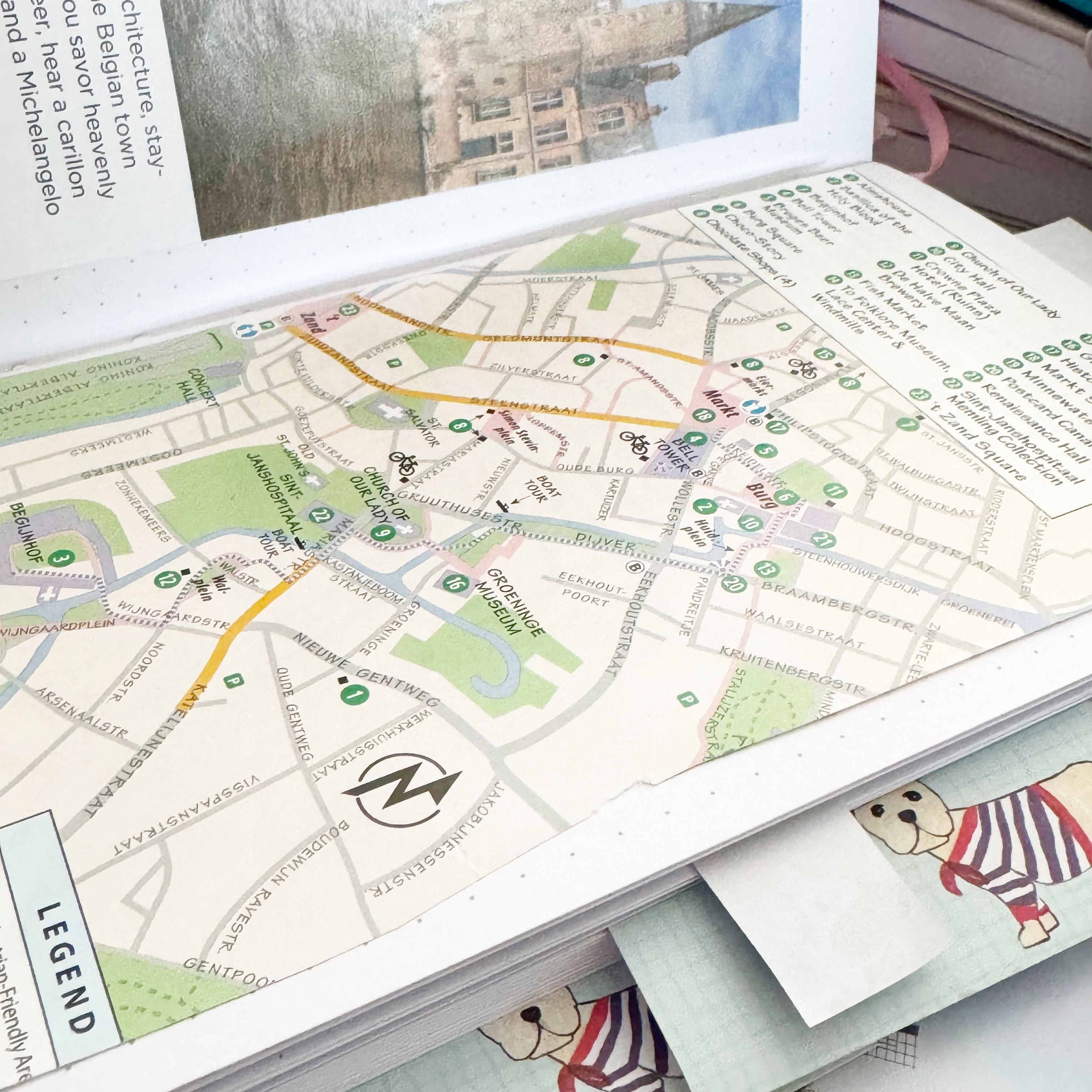 TRAVELS.EDU.VN travel notebook filled with maps, tickets, and photos