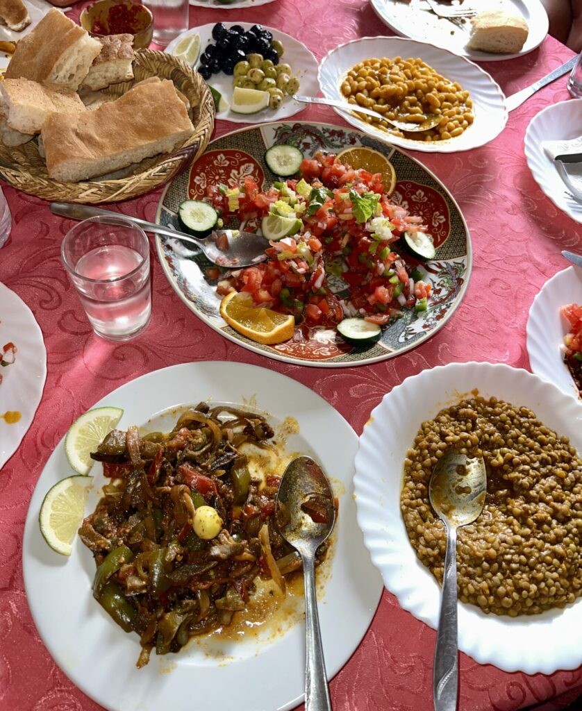 Moroccan Food: Beans, vegetables, tomatoes, bread typical warm and cold plates before the Tagine main meal.