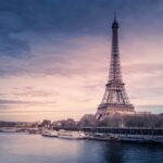 Eiffel Tower in Paris under a dramatic sky