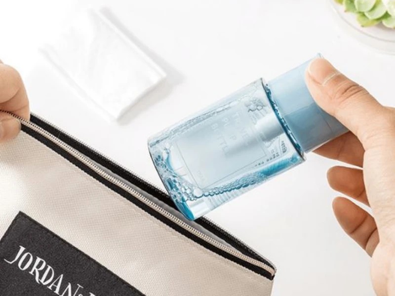 Woman dispensing air from pump bottle