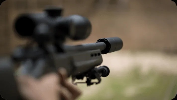 Rifle Suppressor attached to a firearm