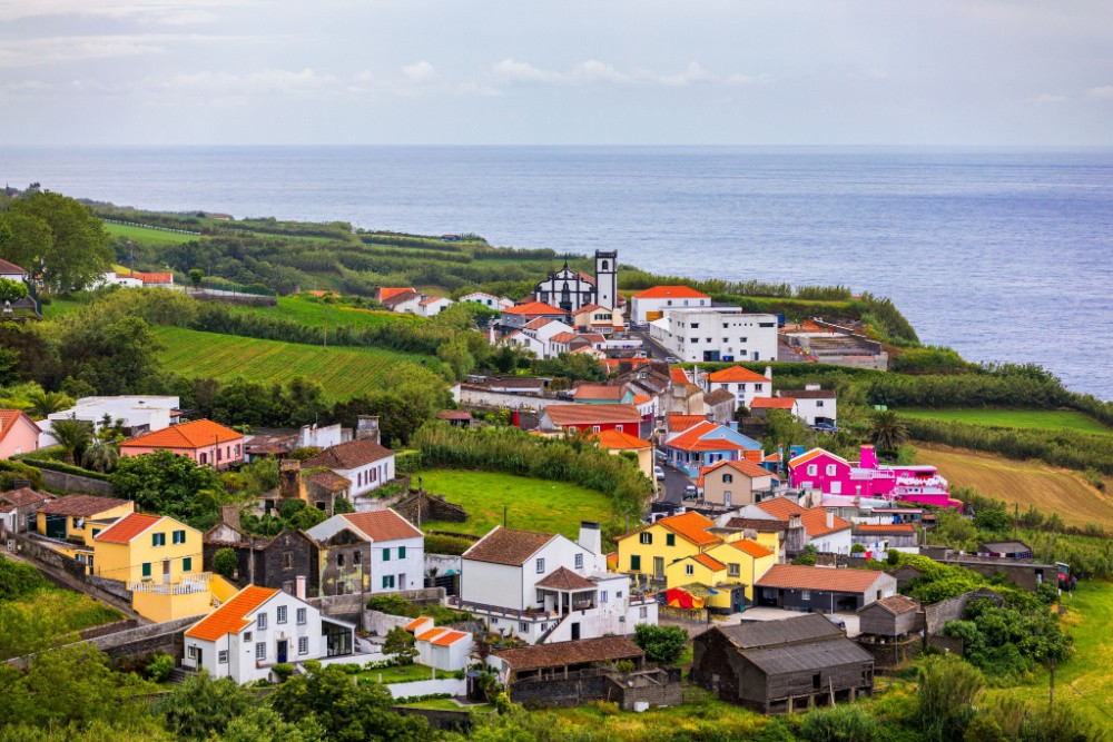 Beautiful nature view on Azores with small villages, tows, green nature fields. Amazing Azores. View of typical Azores village in Sao Miguel island, Azores, Portugal.