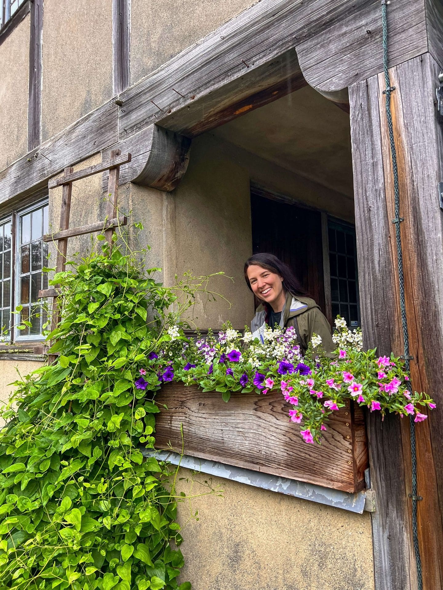 Woman at Topsmead State Forest, Litchfield, Connecticut. The cottage provides an idyllic backdrop.