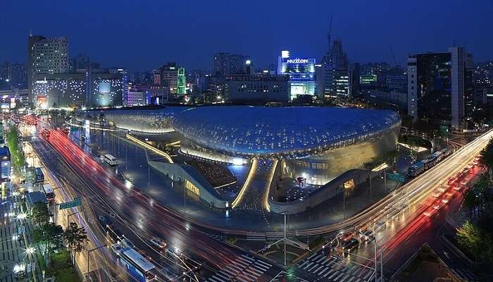 Dongdaemun Design Plaza at night, Seoul, South Korea featuring modern architecture and vibrant lighting
