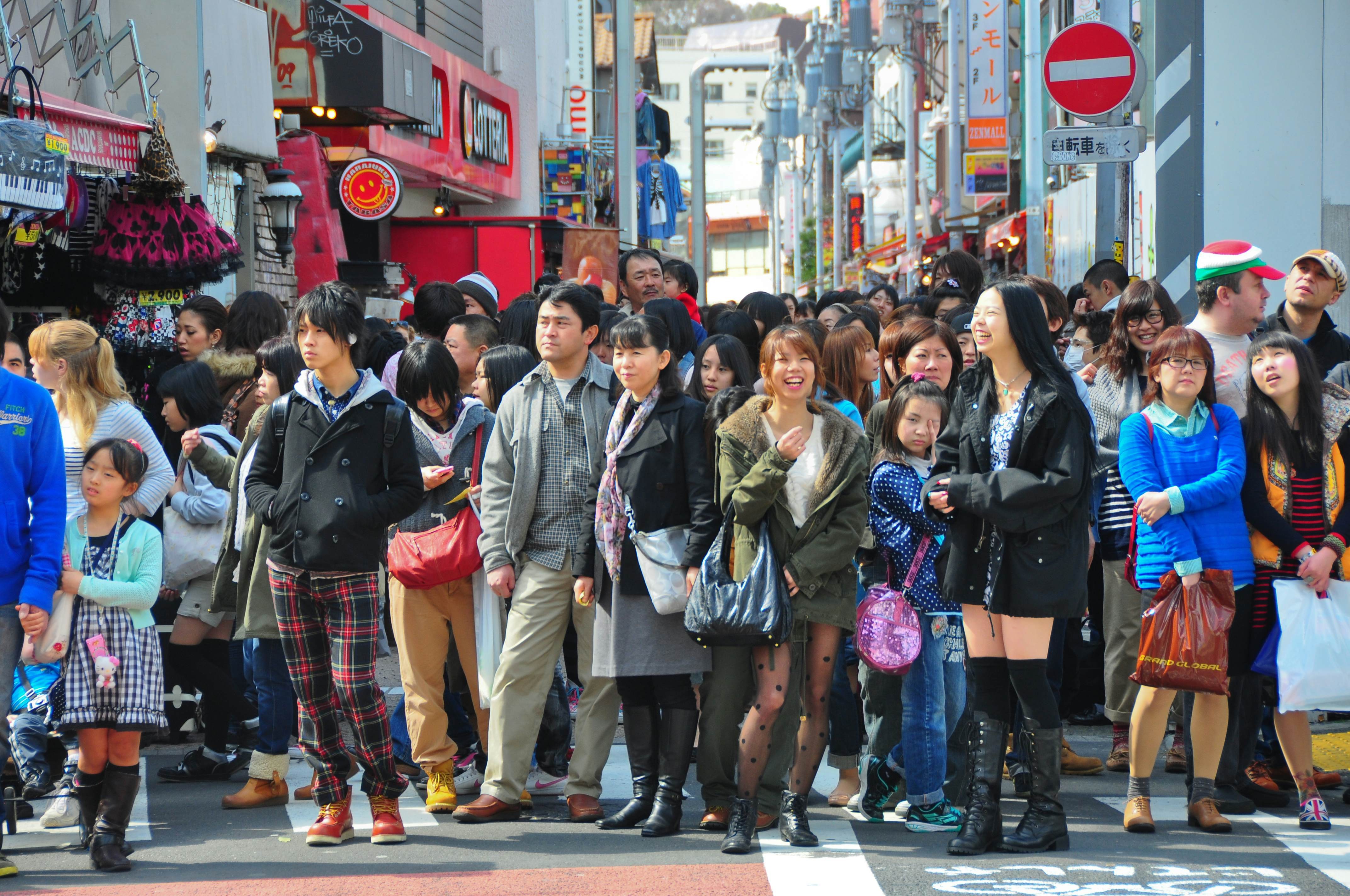 Crowds on Takeshita-dori, Harajuku, Tokyo. The image emphasizes the intensity of crowds in major Japanese cities.