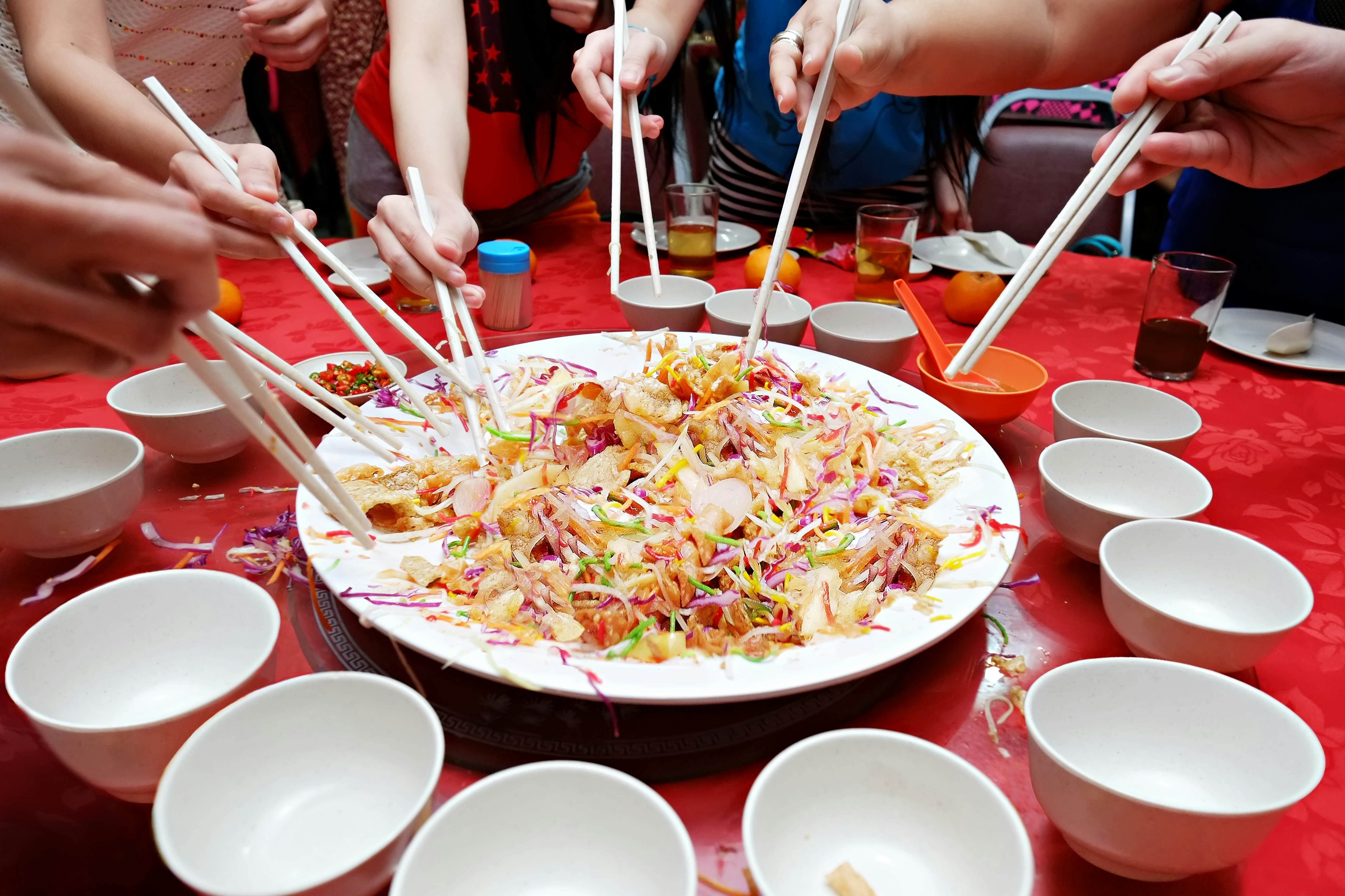 Eager diners about to eat a traditional Chinese meal