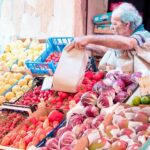 A bustling street in Palermo, Sicily, showcasing the vibrant atmosphere and friendly locals