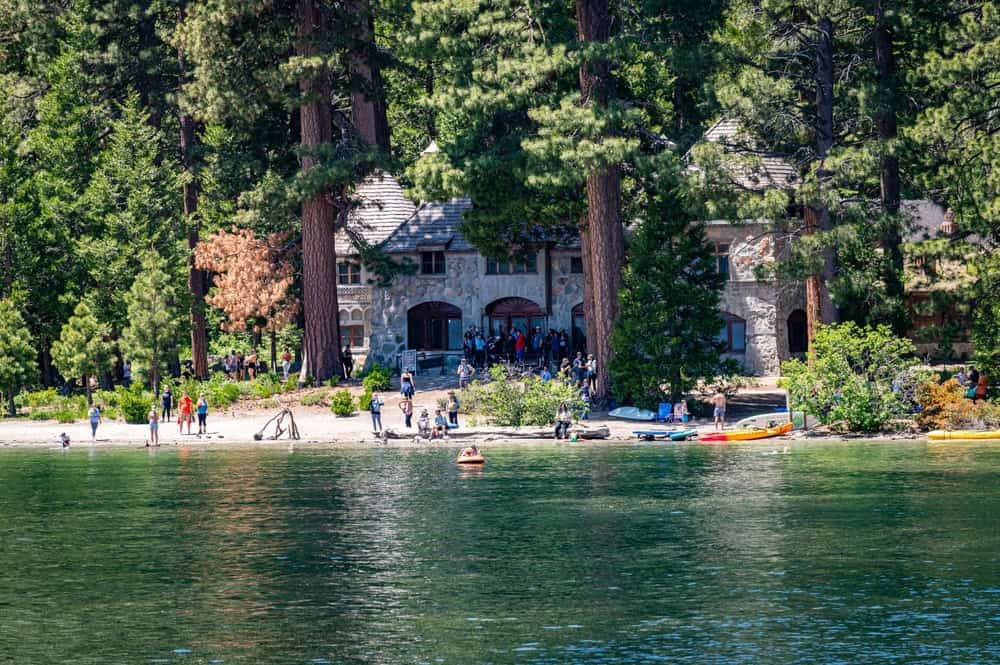 A scenic view of South Lake Tahoe showing the lake and surrounding mountains on a clear day.