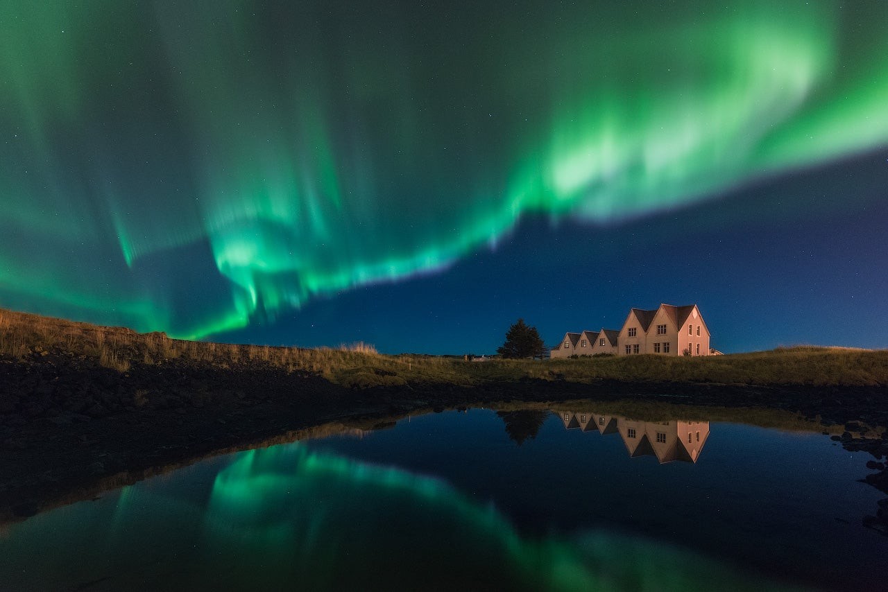 The romantic view of Aurora Borealis in Iceland
