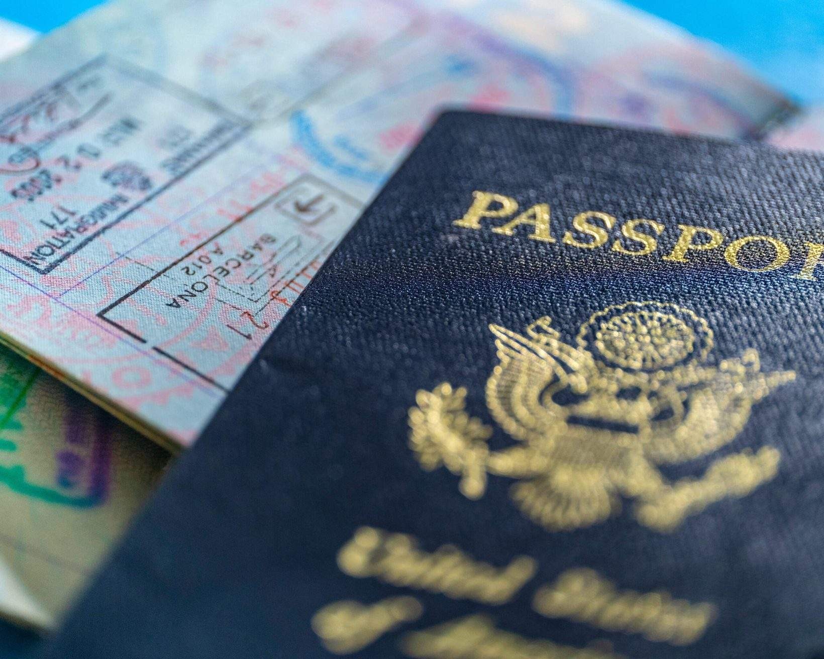USA passport stamps to symbolize international travel.