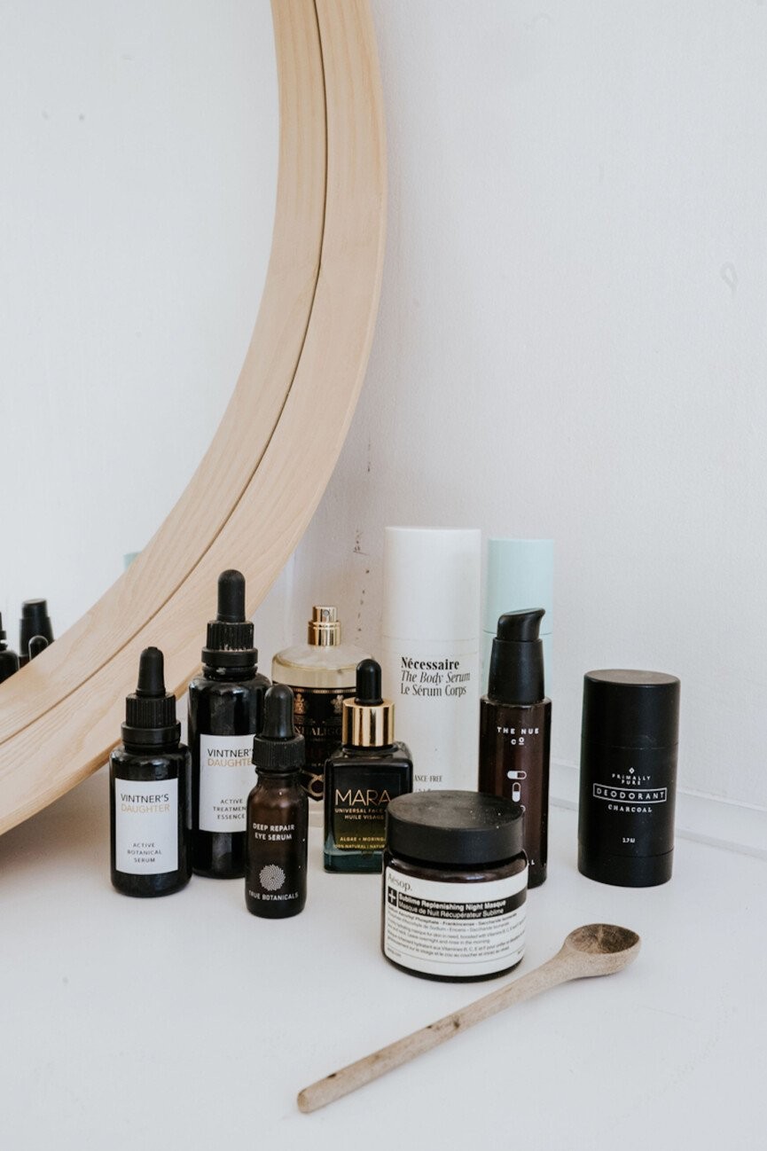 Assortment of travel-sized skincare products organized neatly