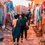 Couple walking through a vibrant Marrakech market