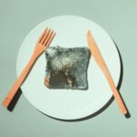 A close-up shot of mold growing on a slice of bread, emphasizing the importance of proper food storage