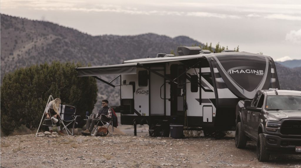 Grand Design Imagine set up for camping by the mountains